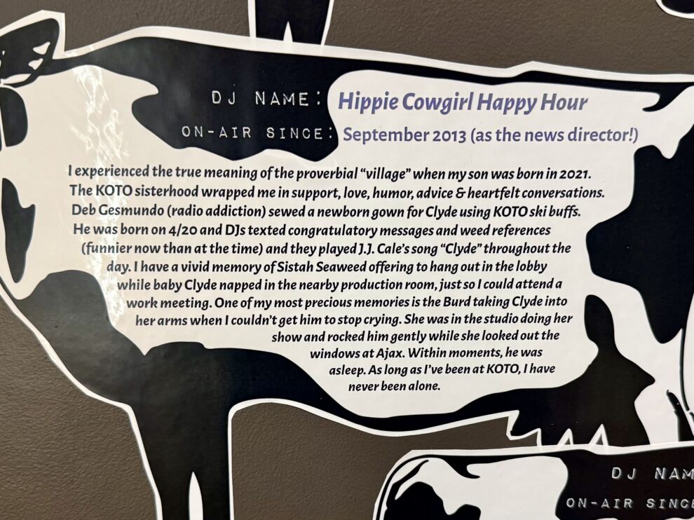 Sign with the DJ name Hippie Cowgirl Happy Hour, listing the start date as September 2013 and highlighting the importance of supportive experiences at KOTO radio station in lifting all boats within the community.