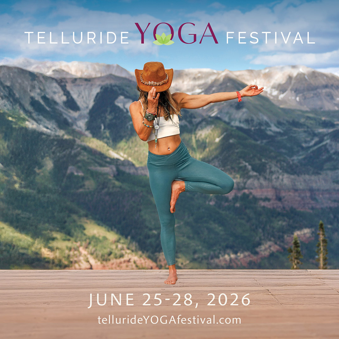 A woman in yoga attire poses in tree pose on a wooden deck with mountains behind her; text promotes the Telluride Yoga Festival, June 25-28, 2026, inviting you to experience wellness and tranquility in scenic Telluride.